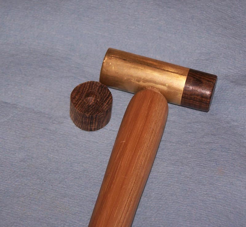 The wooden end of the hammer